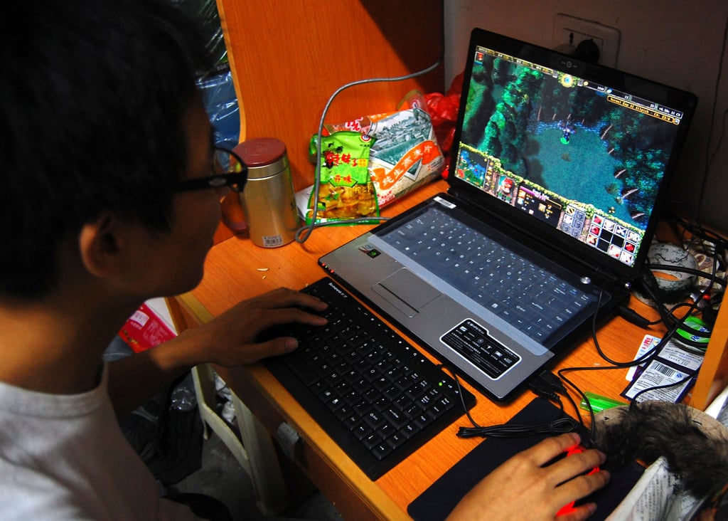 In this file photo, a college student plays the online game World of Warcraft in his dormitory room. Photo: AP Photo In this file photo, a college student plays the online game World of Warcraft in his dormitory room. Photo: AP Photo