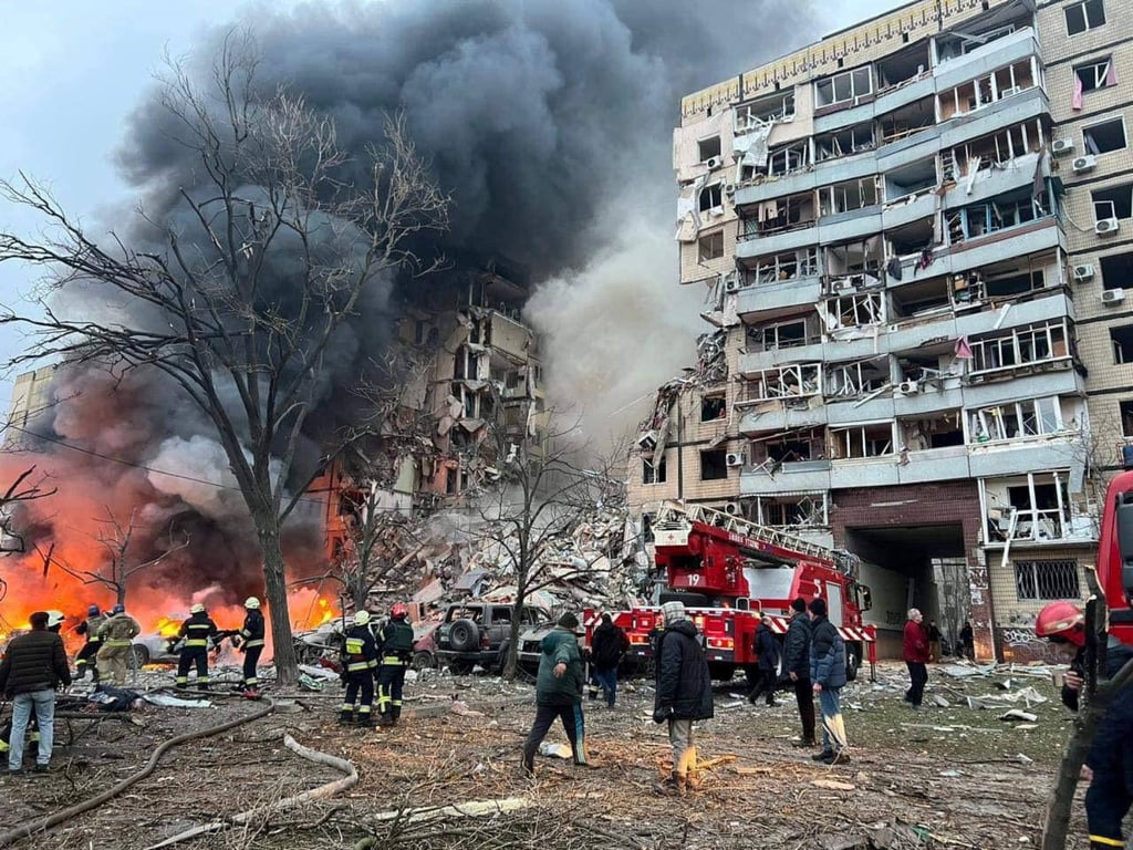 Rescuers and local residents are seen at a site of an apartment building heavily damaged by a Russian missile strike. Photo: via Reuters Rescuers and local residents are seen at a site of an apartment building heavily damaged by a Russian missile strike. Photo: via Reuters
