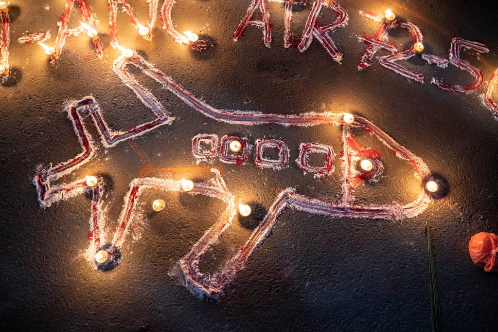 A lamp lighting ceremony in remembrance of victims of a plane crash is attended by college students in Kathmandu, Nepal, on Tuesday. Photo: Xinhua A lamp lighting ceremony in remembrance of victims of a plane crash is attended by college students in Kathmandu, Nepal, on Tuesday. Photo: Xinhua