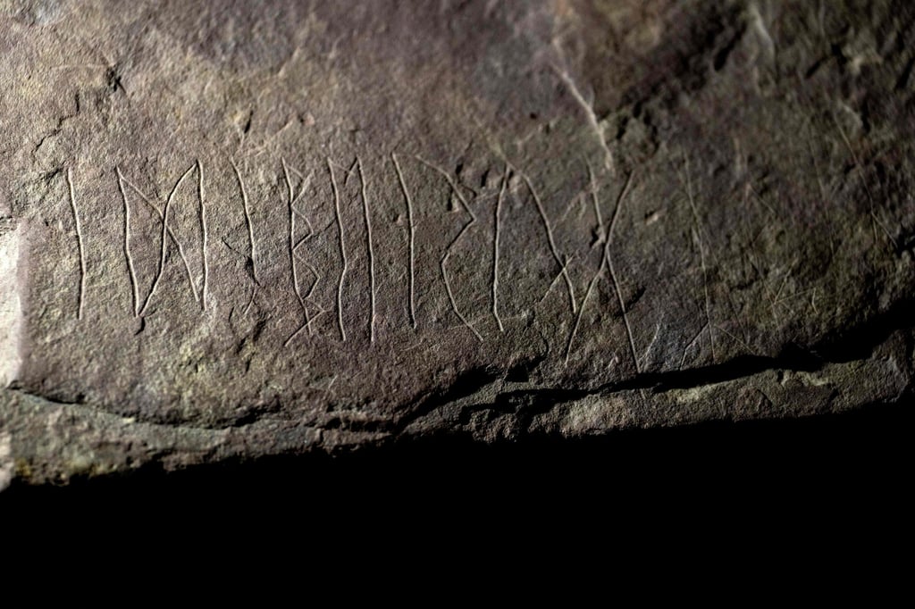 Inscriptions on a sandstone rock, believed to be the world’s oldest runestone inscribed almost 2,000 years ago, are seen in Oslo on Tuesday. Photo: AFP Inscriptions on a sandstone rock, believed to be the world’s oldest runestone inscribed almost 2,000 years ago, are seen in Oslo on Tuesday. Photo: AFP