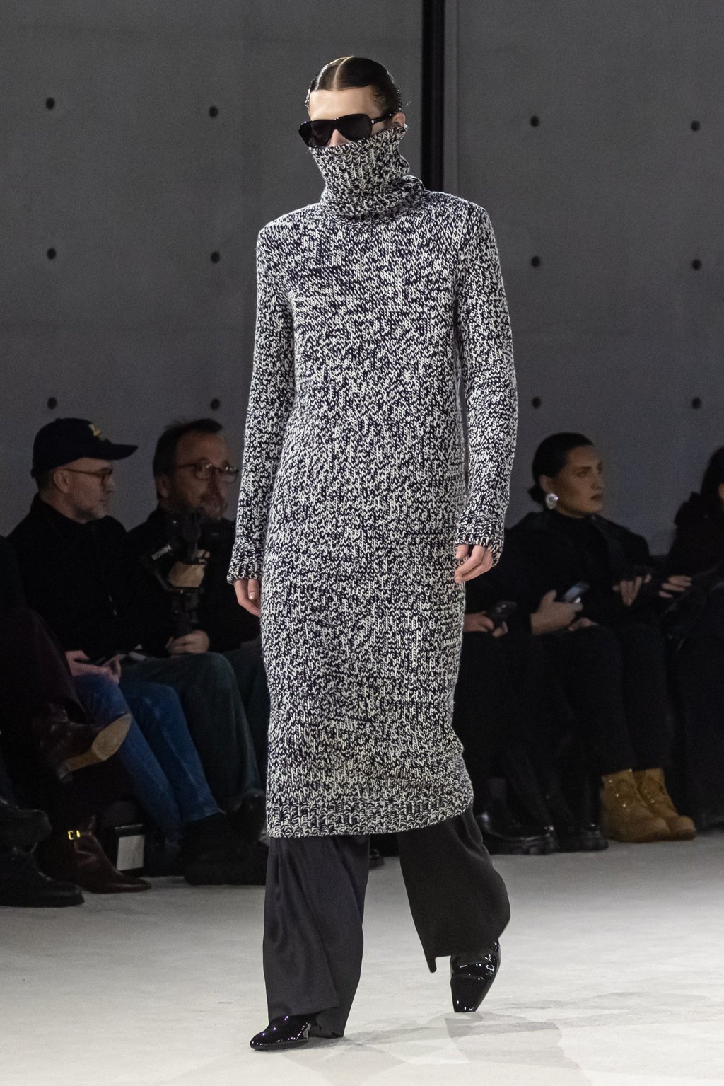 Polo necks were pulled up high as models walked on the runway in pointy, heeled boots for Saint Laurent during Paris Fashion Week. Photo: EPA-EFE Polo necks were pulled up high as models walked on the runway in pointy, heeled boots for Saint Laurent during Paris Fashion Week. Photo: EPA-EFE