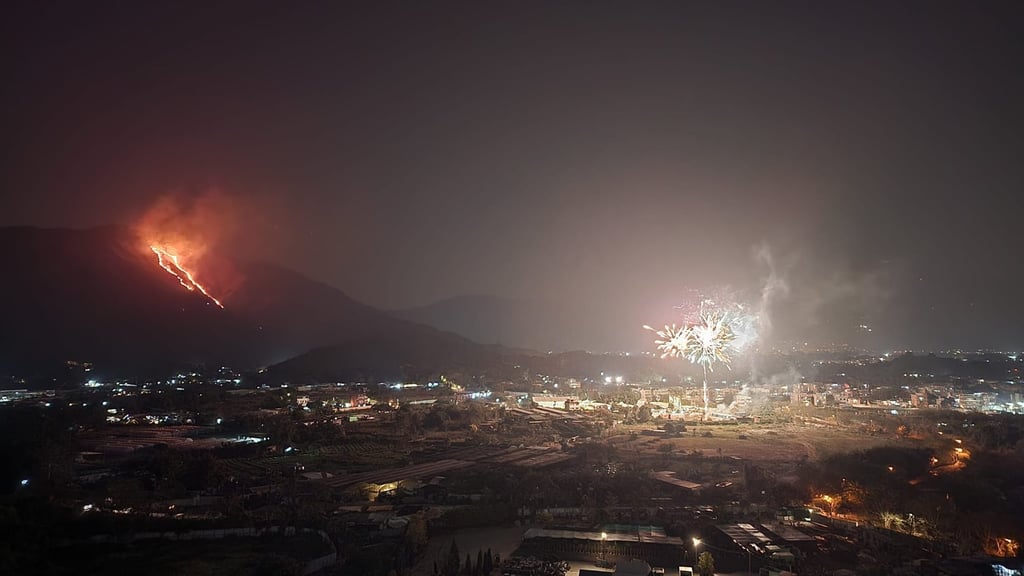 A photo from Facebook captures the spectacle of two trails of hill fires in the New Territories, as well as fireworks. A photo from Facebook captures the spectacle of two trails of hill fires in the New Territories, as well as fireworks.