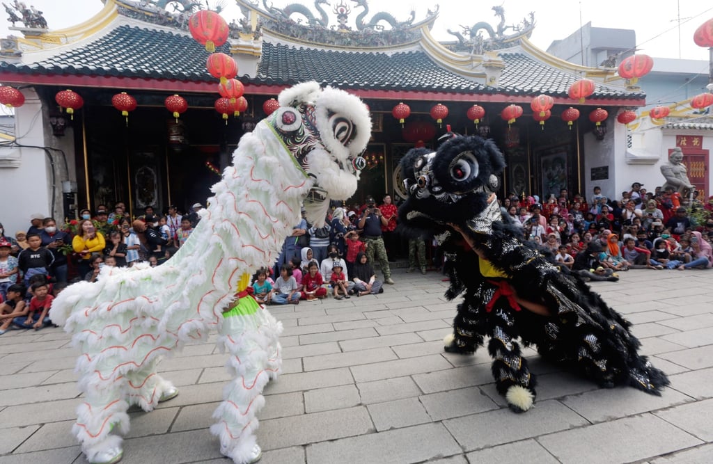 Lion dancers perform during Lunar New Year celebrations at Tay Kak Sie Temple in Semarang, Indonesia, on Sunday. Photo: EPA-EFE
