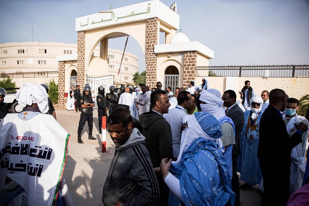 People gather outside the courthouse during the opening of former Mauritania president Mohamed Ould Abdel Aziz’s corruption trial in Nouakchott on Wednesday. Photo: AFP People gather outside the courthouse during the opening of former Mauritania president Mohamed Ould Abdel Aziz’s corruption trial in Nouakchott on Wednesday. Photo: AFP