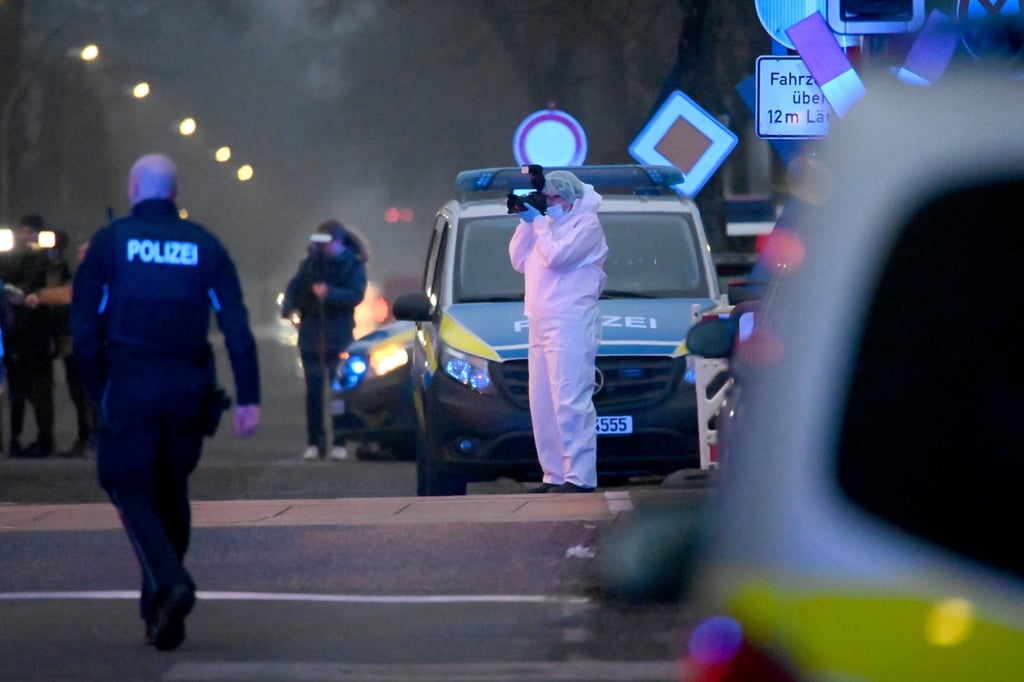 A forensic team works at a level crossing at Brokstedt station in Germany on Wednesday. Photo: dpa