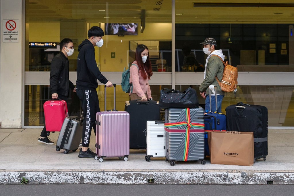International students from China arrive at an airport in Sydney to a catch a flight home in 2020 amid the coronavirus pandemic. Tens of thousands of Chinese students remain offshore after pandemic restrictions and strained diplomatic relations led many to return home. Photo: Reuters