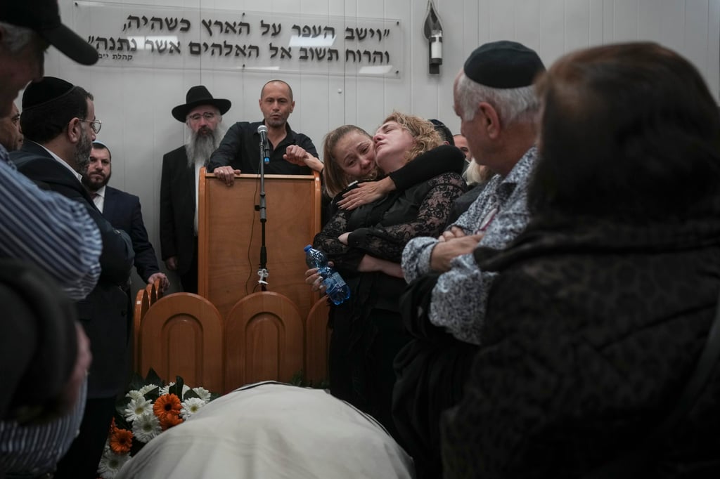Mourners attend the funeral of Rafael Ben Eliyahu, a victim of a shooting attack on Friday in east Jerusalem, at Givat Shaul cemetery in Jerusalem, Israel on Sunday. Photo: AP