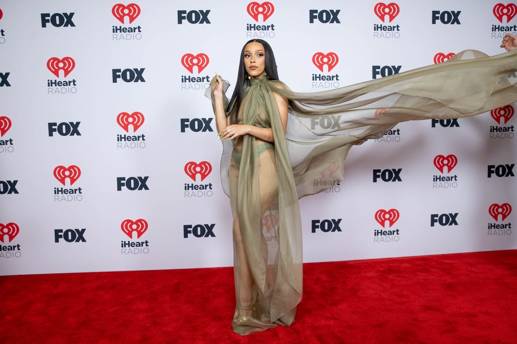 Doja Cat arrived at the 2021 iHeartRadio Music Awards wearing a totally sheer gown, but kept her make-up simple. Photo: Getty Images for iHeartMedia Doja Cat arrived at the 2021 iHeartRadio Music Awards wearing a totally sheer gown, but kept her make-up simple. Photo: Getty Images for iHeartMedia