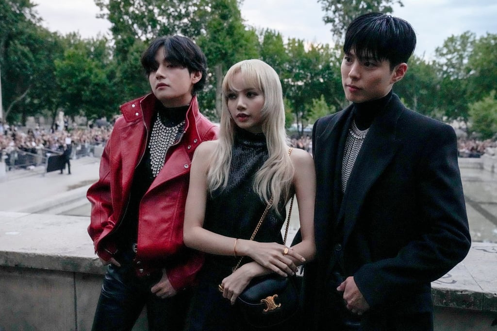 V, Lisa and Park Bo-gum pose for photographers before the Celine men’s spring/summer 2023 collection presented in Paris, France, in June 2022. Photo: AP V, Lisa and Park Bo-gum pose for photographers before the Celine men’s spring/summer 2023 collection presented in Paris, France, in June 2022. Photo: AP