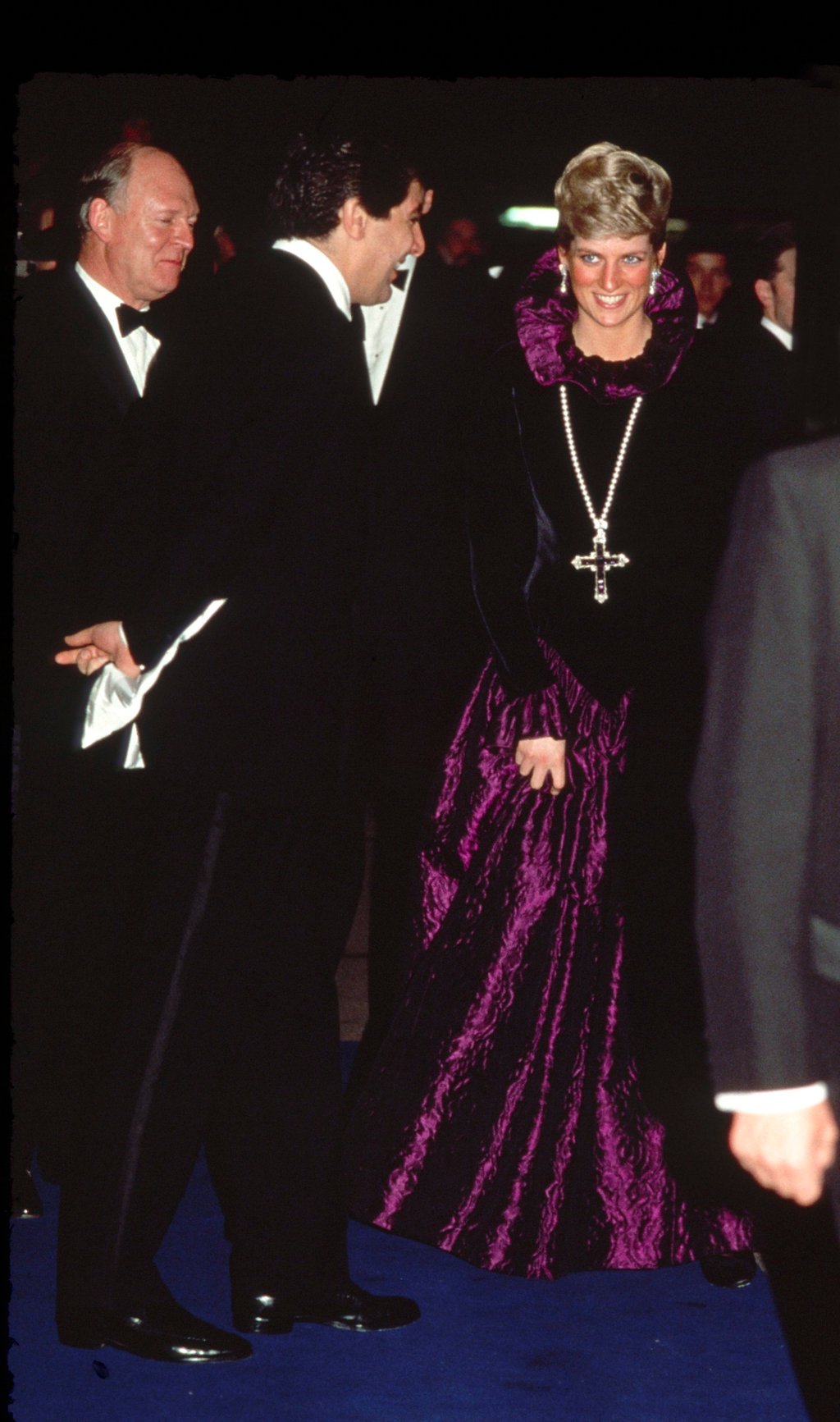 Diana, Princess of Wales, arrives at a charity gala evening, wearing a purple evening dress with a gold and amethyst pendant in 1987. Photo: Getty Images