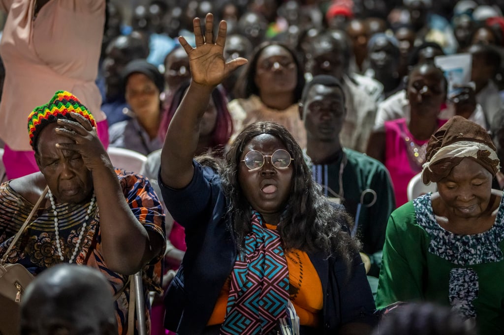 People sing as Pope Francis conducts an ecumenical prayer service at the John Garang Mausoleum in Juba, South Sudan on Saturday. Photo: AP