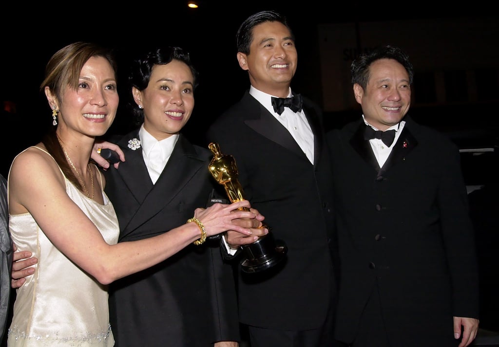 Michelle Yeoh (left) holds the Oscar for best foreign film with the film’s lead actor Chow Yun-Fat, second from right, with his wife Jasmine Chow at his side and the director of the film Ang Lee at the Sony Pictures party in Beverly Hills, California, after the 73rd annual Academy Awards, in 2001. Photo: AP Michelle Yeoh (left) holds the Oscar for best foreign film with the film’s lead actor Chow Yun-Fat, second from right, with his wife Jasmine Chow at his side and the director of the film Ang Lee at the Sony Pictures party in Beverly Hills, California, after the 73rd annual Academy Awards, in 2001. Photo: AP