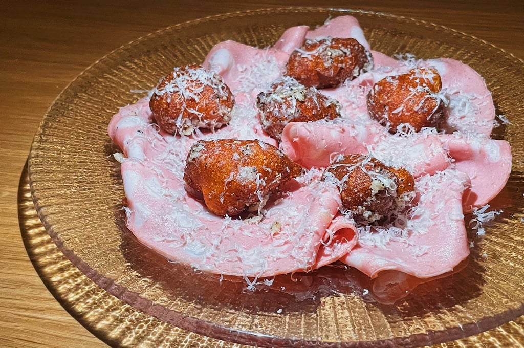 At Grandmaster Recorders in Hollywood, Los Angeles, mortadella comes with cheese and pepper-seasoned zeppole (doughnuts) and pecorino cheese. Photo: TNS At Grandmaster Recorders in Hollywood, Los Angeles, mortadella comes with cheese and pepper-seasoned zeppole (doughnuts) and pecorino cheese. Photo: TNS