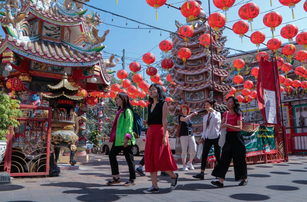 Tourists from China and elsewhere tour a temple in Thailand’s Chiang Mai province last month. Economists say the return of Chinese tourists is likely to buttress Asian economies. Photo: AP Tourists from China and elsewhere tour a temple in Thailand’s Chiang Mai province last month. Economists say the return of Chinese tourists is likely to buttress Asian economies. Photo: AP