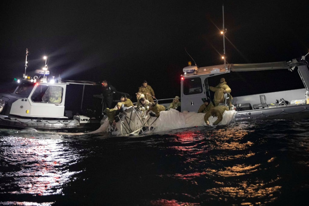 Sailors assigned to Explosive Ordnance Disposal Group 2 recover a suspected Chinese high-altitude surveillance balloon from US territorial waters off the coast of Myrtle Beach, South Carolina, after it was downed by the United States over the weekend. Photo: US Navy via Reuters
