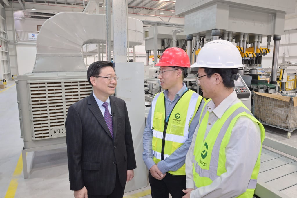 City leader John Lee (left) speaks to workers at the Chinese-built Demonstration Park in the UAE. Photo: Handout