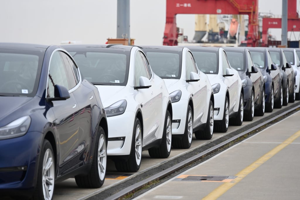Tesla electric vehicles wait to be loaded onto a cargo vessel at Nangang port in Shanghai on May 15, 2022. Photo: Getty Images