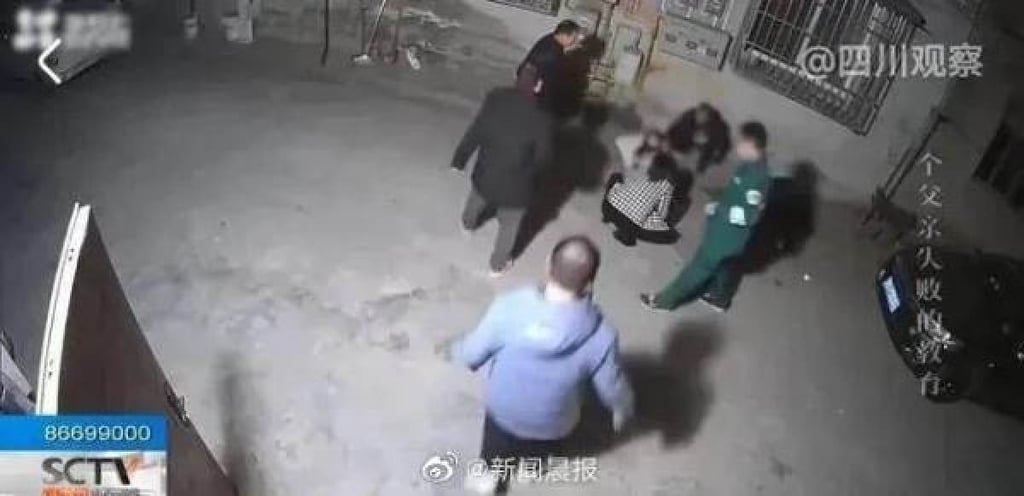 Emergency services outside the home where the killing took place. The boy was taken to hospital but later died from blood loss. Photo: Weibo