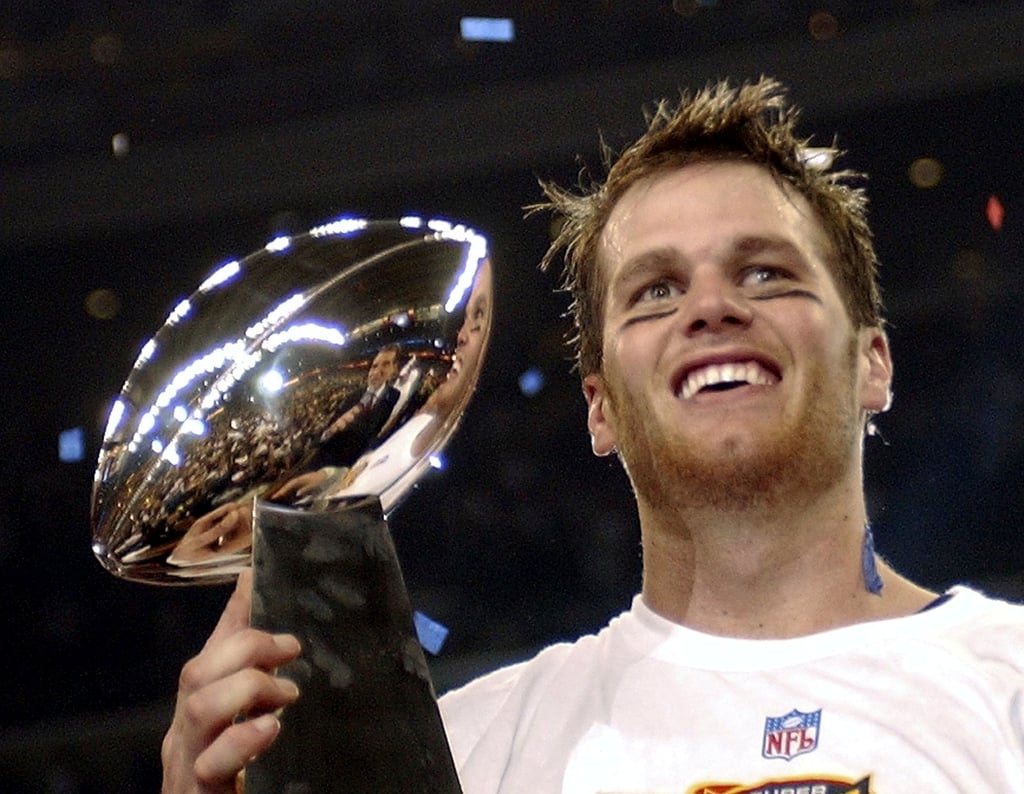 New England Patriots quarterback Tom Brady holds the Vince Lombardi Trophy after the Patriots beat the Carolina Panthers 32-29 in Super Bowl 38 in Houston, in 2004. Photo: AP New England Patriots quarterback Tom Brady holds the Vince Lombardi Trophy after the Patriots beat the Carolina Panthers 32-29 in Super Bowl 38 in Houston, in 2004. Photo: AP