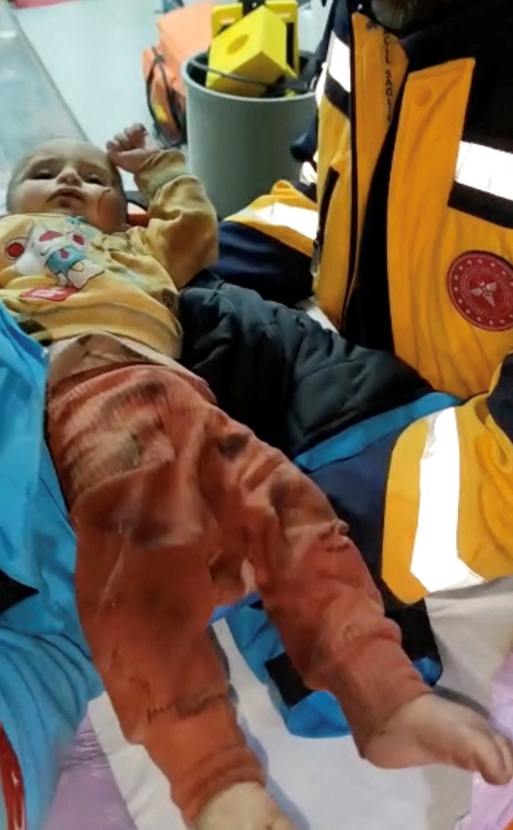 Rescuers hold a seven-month-old baby who survived a deadly earthquake, after 140 hours trapped under the rubble, in Hatay, Turkey. Photo: Kocaeli Metropolitan Municipality / Handout via Reuters Rescuers hold a seven-month-old baby who survived a deadly earthquake, after 140 hours trapped under the rubble, in Hatay, Turkey. Photo: Kocaeli Metropolitan Municipality / Handout via Reuters