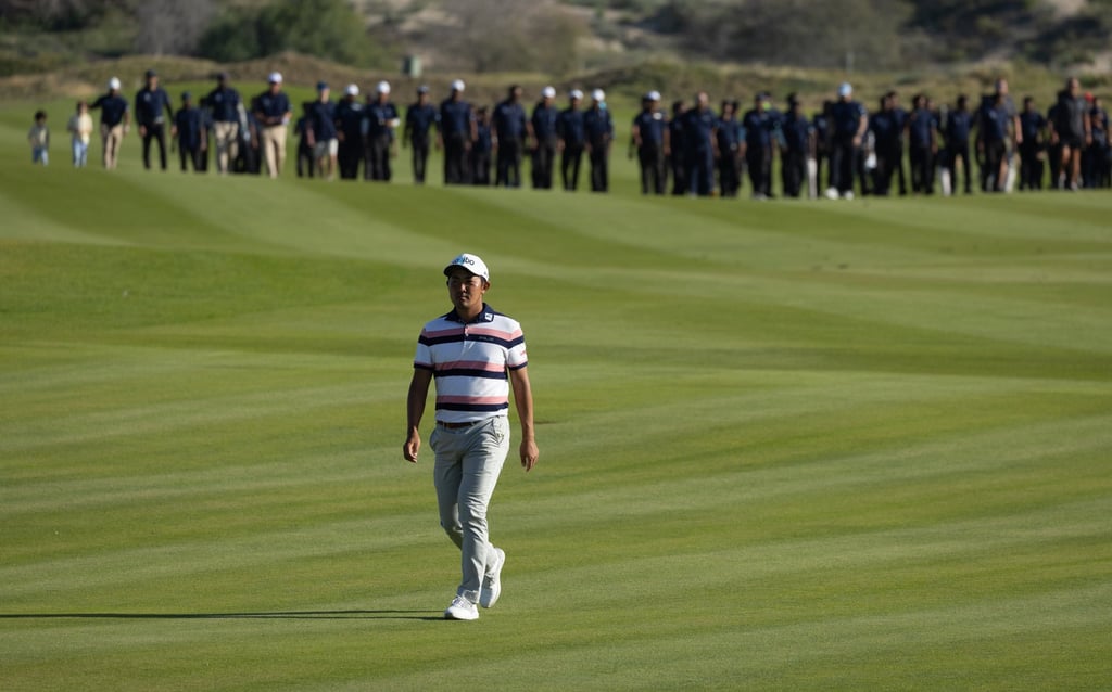 Takumi Kanaya walks down the fairway at the International Series Oman at Al Mouj Golf Club. Photo: Asian Tour.