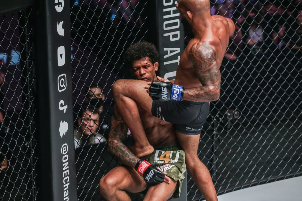 Demetrious Johnson knocks out Adriano Moraes with a knee to win the flyweight MMA title. Photo: ONE Championship. Demetrious Johnson knocks out Adriano Moraes with a knee to win the flyweight MMA title. Photo: ONE Championship.