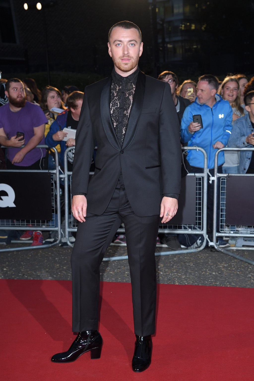 Sam Smith attends the GQ Men of the Year Awards 2019 in a black suit, lace shirt and heels. Photo: WireImage Sam Smith attends the GQ Men of the Year Awards 2019 in a black suit, lace shirt and heels. Photo: WireImage