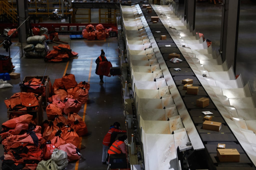 Employees check packages at a logistics centre of JD.com in Beijing on January 10, 2023. Photo: Reuters Employees check packages at a logistics centre of JD.com in Beijing on January 10, 2023. Photo: Reuters