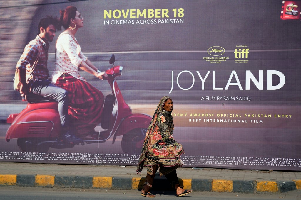 A woman in Lahore walks past a promotional hoarding of the movie “Joyland” displayed outside a cinema on November 17, 2022. Photo: AP A woman in Lahore walks past a promotional hoarding of the movie “Joyland” displayed outside a cinema on November 17, 2022. Photo: AP