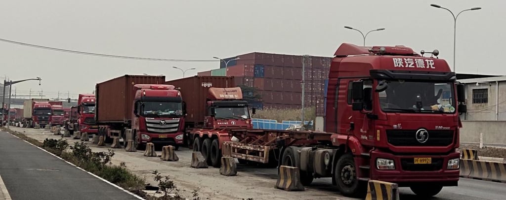Container trucks sit idle on the side of the road in Shenzhen. Photo: Weibo Container trucks sit idle on the side of the road in Shenzhen. Photo: Weibo