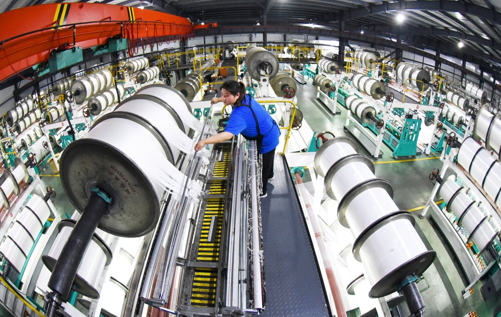 An employee work on a production line at a weaving workshop in an economic development zone in Lianyungang, east China’s Jiangsu Province, on October 19, 2020. Photo: Xinhua An employee work on a production line at a weaving workshop in an economic development zone in Lianyungang, east China’s Jiangsu Province, on October 19, 2020. Photo: Xinhua