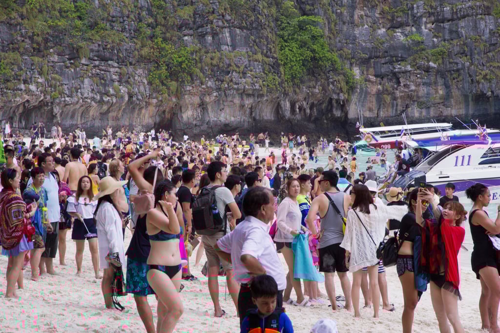 Idyllic Maya Bay Beach, Phi Phi Islands, Thailand, is showing the strains of being a honeypot tourist destination with overcrowding. Photo: Shutterstock Idyllic Maya Bay Beach, Phi Phi Islands, Thailand, is showing the strains of being a honeypot tourist destination with overcrowding. Photo: Shutterstock
