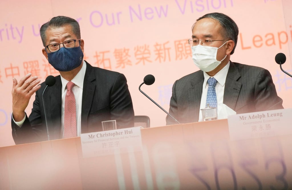 Paul Chan (left) with Christopher Hui at a budget briefing on Wednesday. Photo: Elson Li