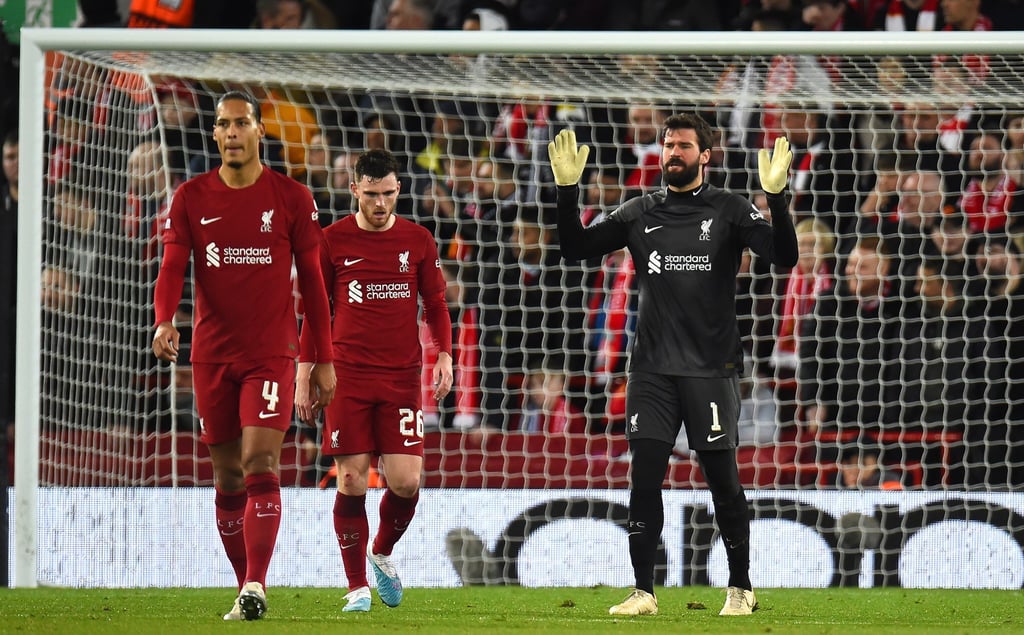 Liverpool goalkeeper Alisson Becker (right), Andy Robertson and Virgil van Dijk (left) react after Real Madrid score their fifth goal. Photo: EPA-EFE