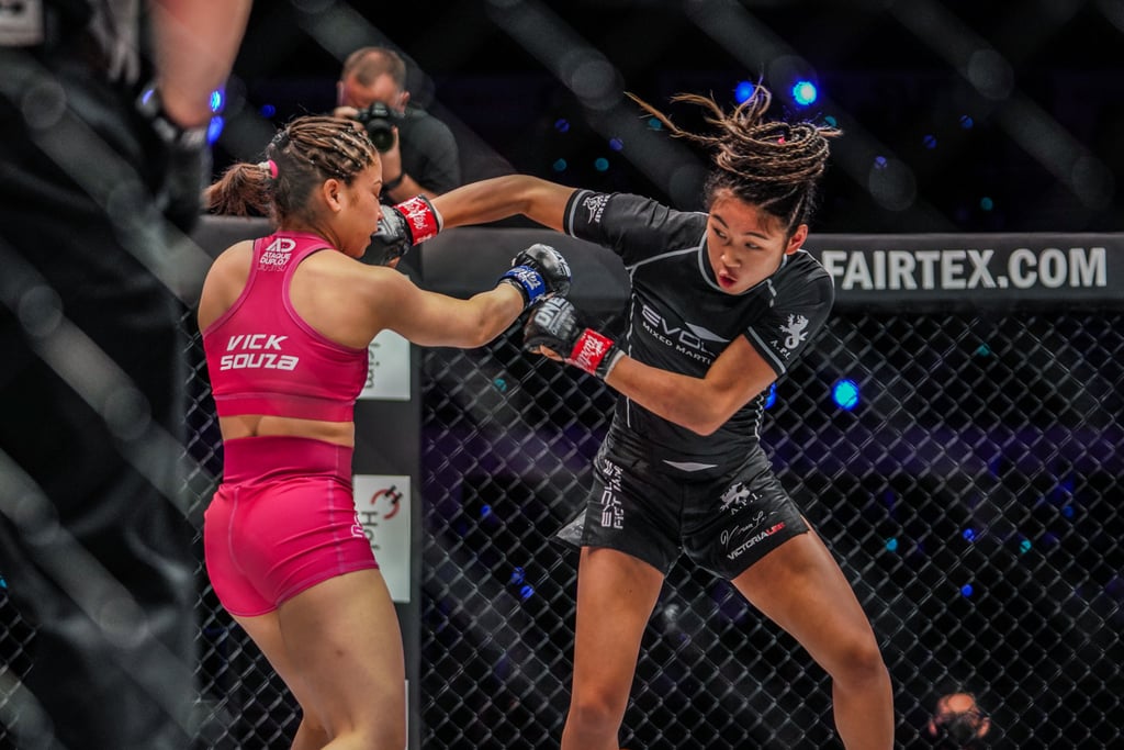 Victoria Souza (left) and Victoria Lee exchange strikes in their 2021 fight.