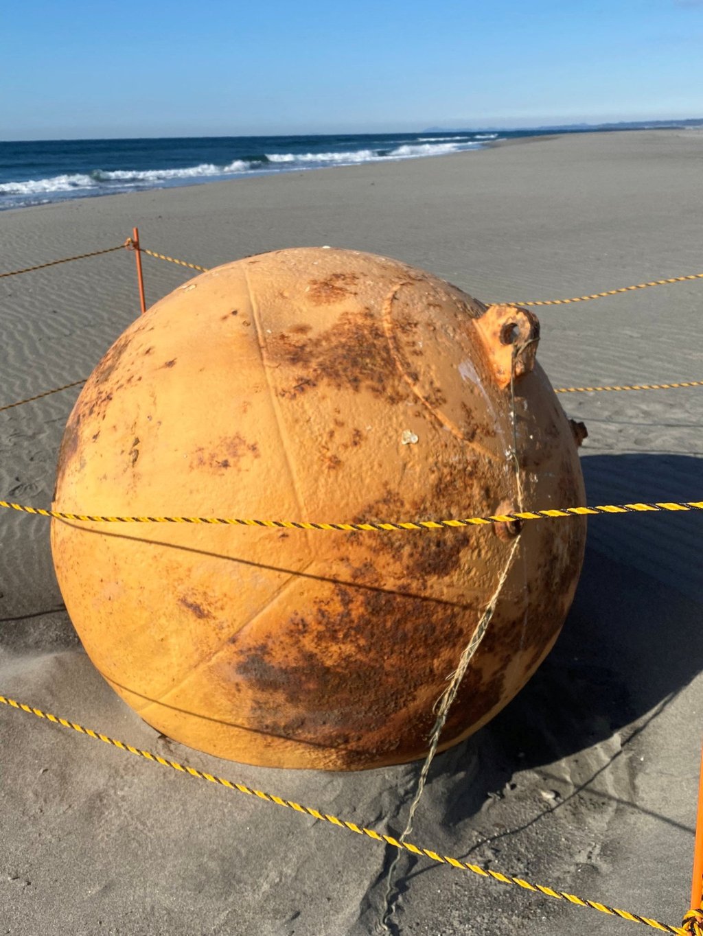 A passer-by reported the object to police on Saturday, but it’s thought the sphere had sat on the beach for more than a month. Photo: Twitter/@XMiS10C4M6QthSG via Reuters