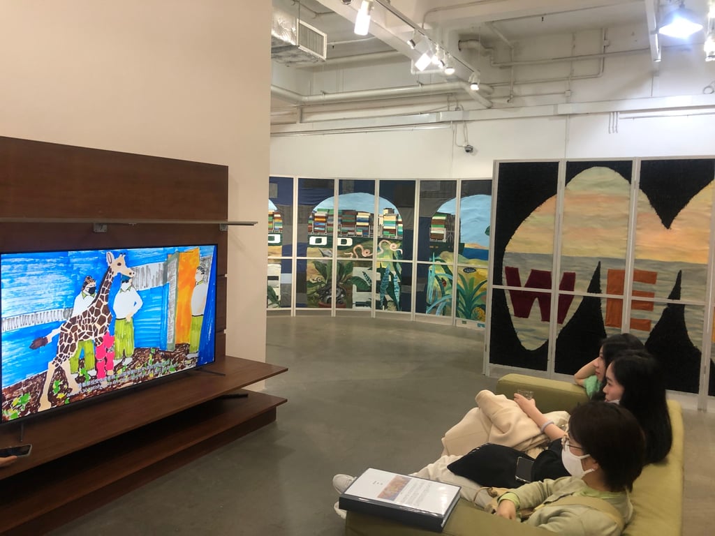 Visitors watch Bolohope’s sitcom at Hanart TZ Gallery. Photo: Enid Tsui