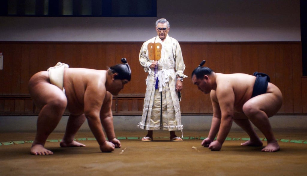 Levy travels to different parts of the world in his new travel show, including Japan, where he witnesses sumo. Photo: AppleTV+ Levy travels to different parts of the world in his new travel show, including Japan, where he witnesses sumo. Photo: AppleTV+