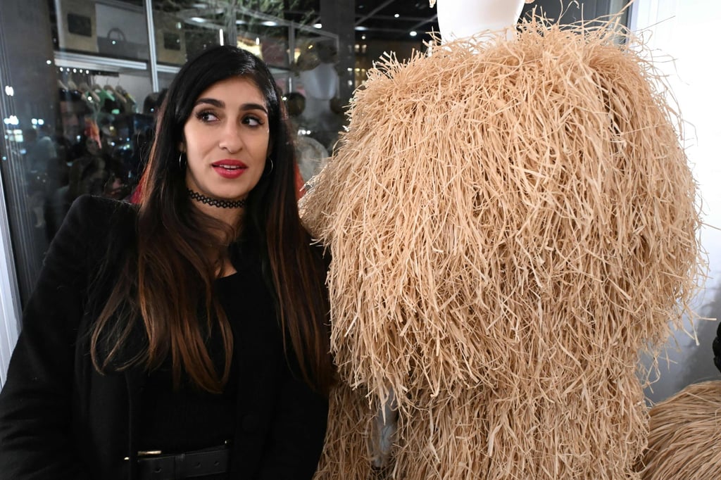 Madagascar fashion designer Eileen Claudia Akbaraly poses next to her creation at the Afrofashion at Modes event during the Fashion Week in Milan on February 22. Photo: AFP