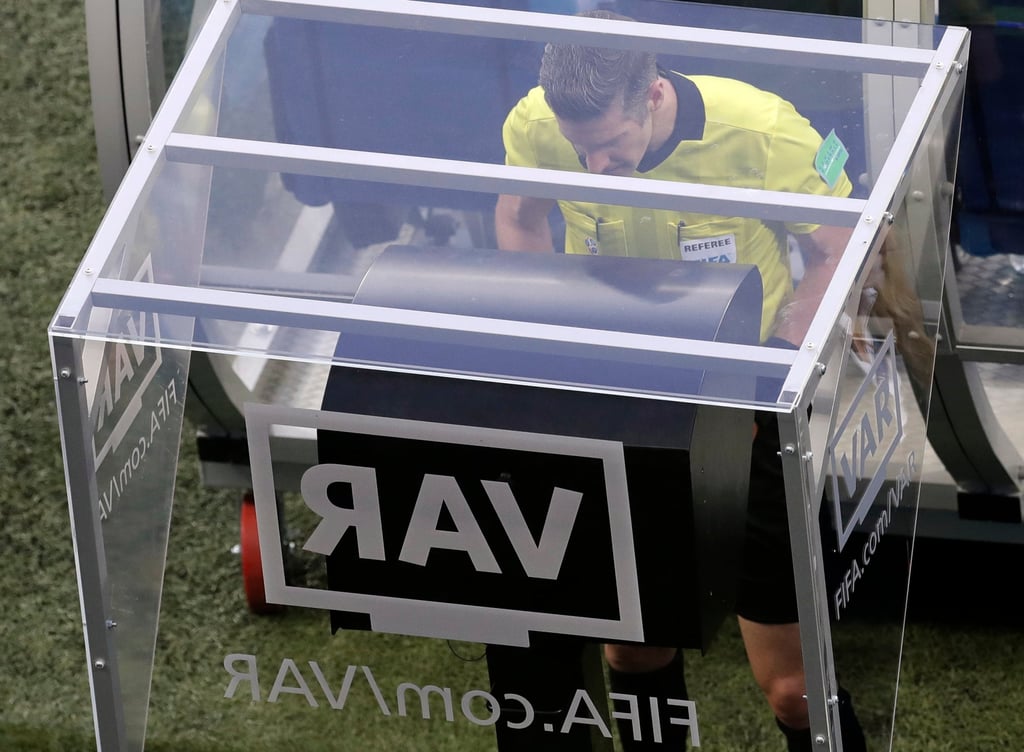 Referee Matt Conger from New Zealand uses VAR during a Group D match between Nigeria and Iceland at the 2018 World Cup in Russia. Photo: 2018