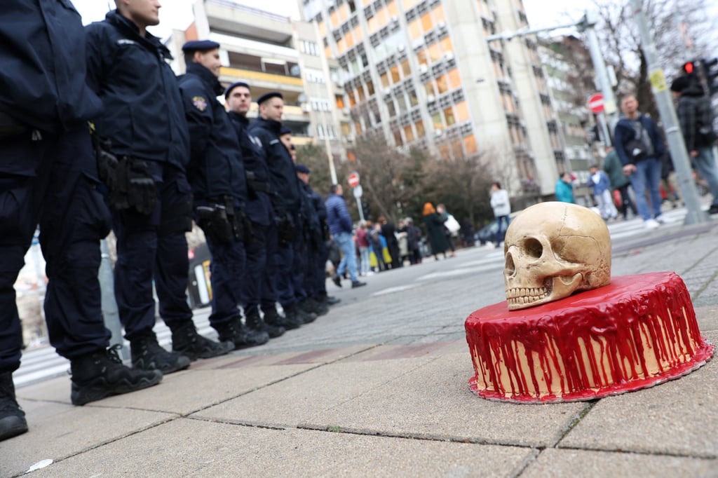 A bloody cake and a fake skull, delivered by pro-Ukrainian activists is seen opposite police guarding the Russian embassy in Belgrade, Serbia, on Friday. Photo: Reuters A bloody cake and a fake skull, delivered by pro-Ukrainian activists is seen opposite police guarding the Russian embassy in Belgrade, Serbia, on Friday. Photo: Reuters