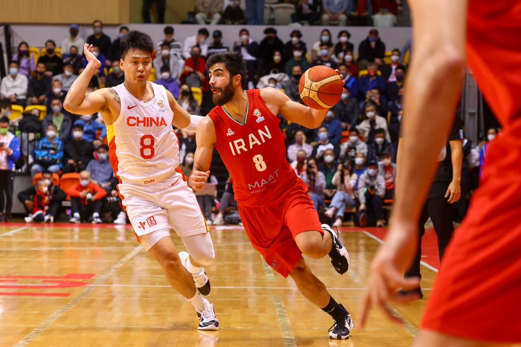 Iran’s guard Behnam Yakhchali (right) dribbles past China’s Zhao Rui during Sunday’s game at Tsuen Wan Sports Centre. Photo: Dickson Lee