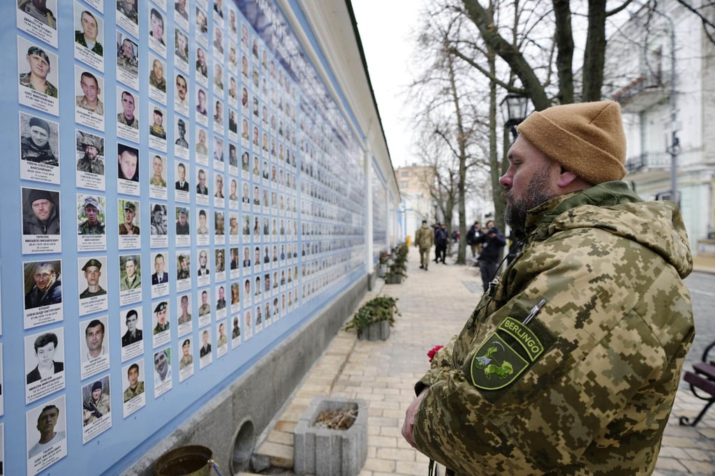 Photos of Ukrainian soldiers killed in the war with Russia are posted on the wall of St Michael’s Golden-Domed Monastery in Kyiv. Photo: Kyodo