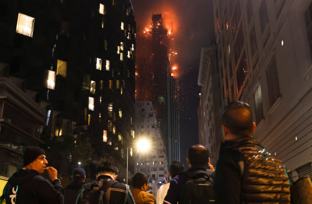 Residents view the blaze from a safe distance. Photo: Edmond So