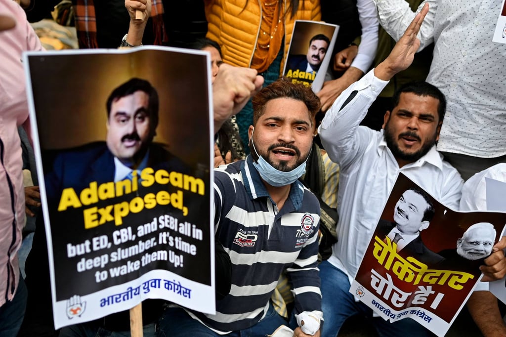 Activists from the youth wing of India’s Congress party hold placards and shout slogans as they protest outside the regional headquarters of the Life Insurance Corporation of India in New Delhi last month. Photo: AFP Activists from the youth wing of India’s Congress party hold placards and shout slogans as they protest outside the regional headquarters of the Life Insurance Corporation of India in New Delhi last month. Photo: AFP
