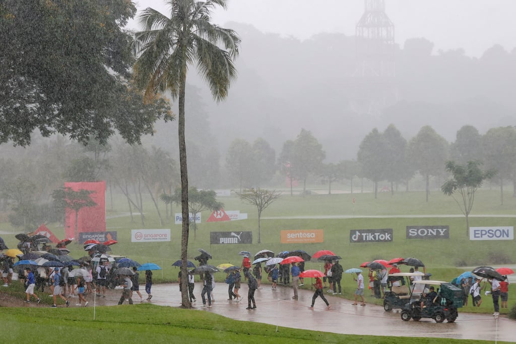 A thunderstorm disrupts the HSBC Women’s World Championship in Singapore on Sunday. Photo: AP