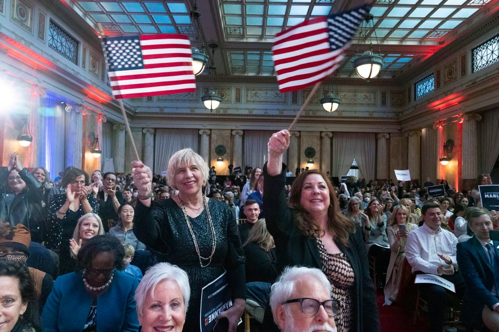 Supporters cheer as self-help author Marianne Williamson speaks to the crowd while launching her 2024 presidential campaign in Washington on Saturday. Photo: AP