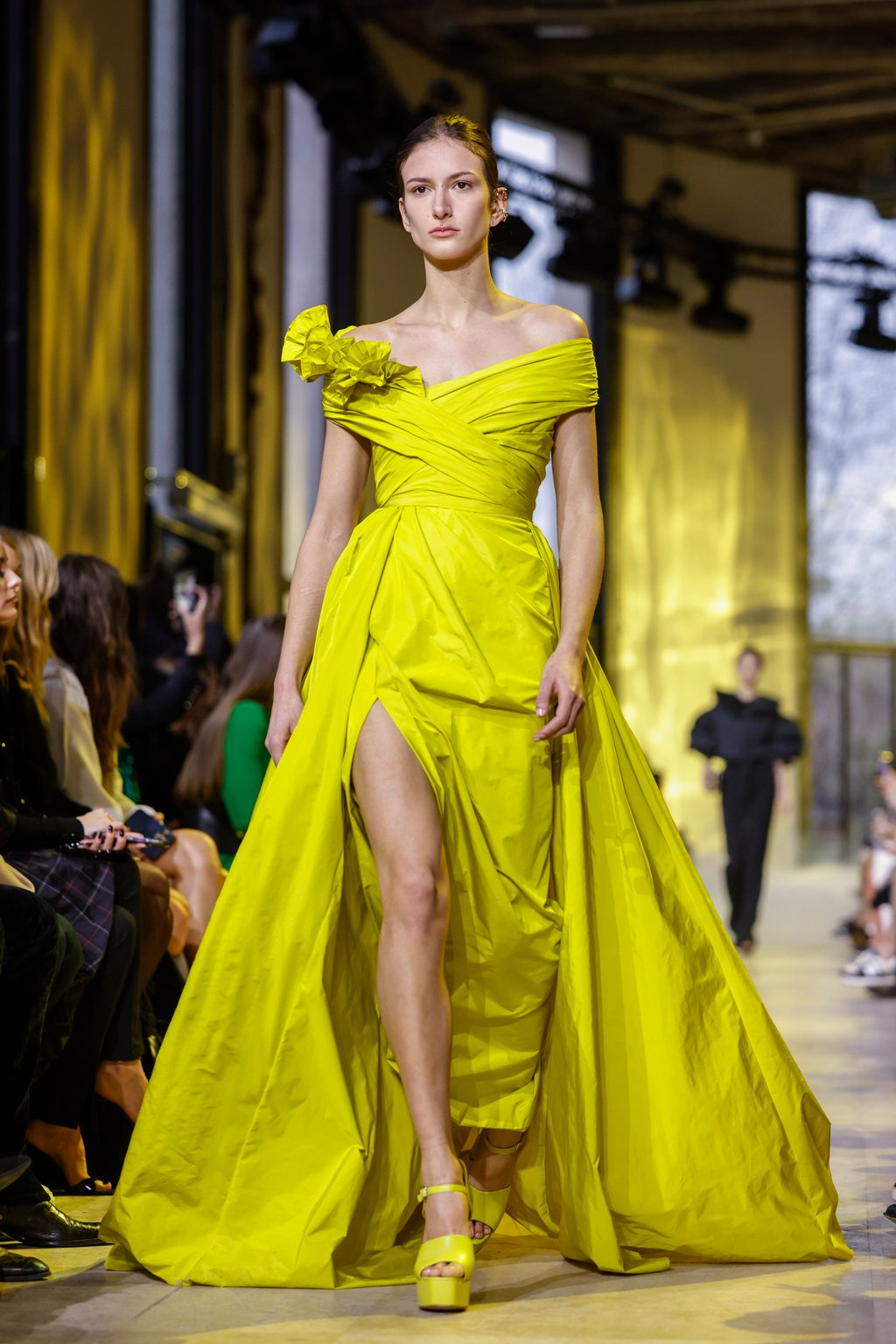 A model wears a bold lime-green creation as part of the Elie Saab autumn/winter 2023-24 ready-to-wear collection presented on March 4, in Paris. Photo: AP