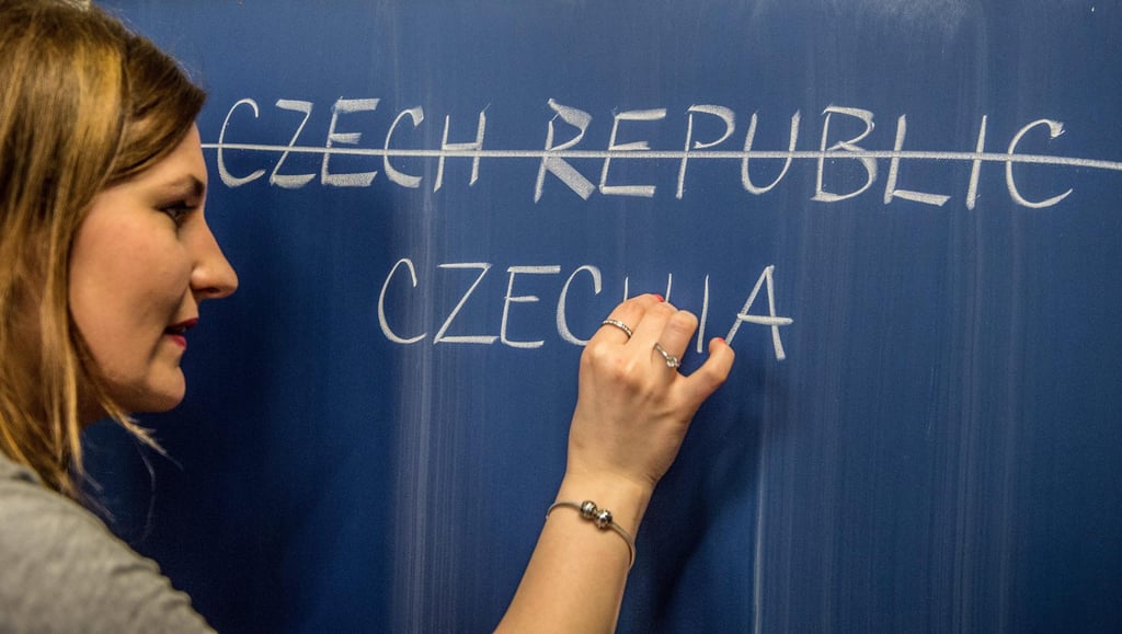 A teacher writes the new English name for the Czech Republic on a blackboard in Prague. Photo: EPA