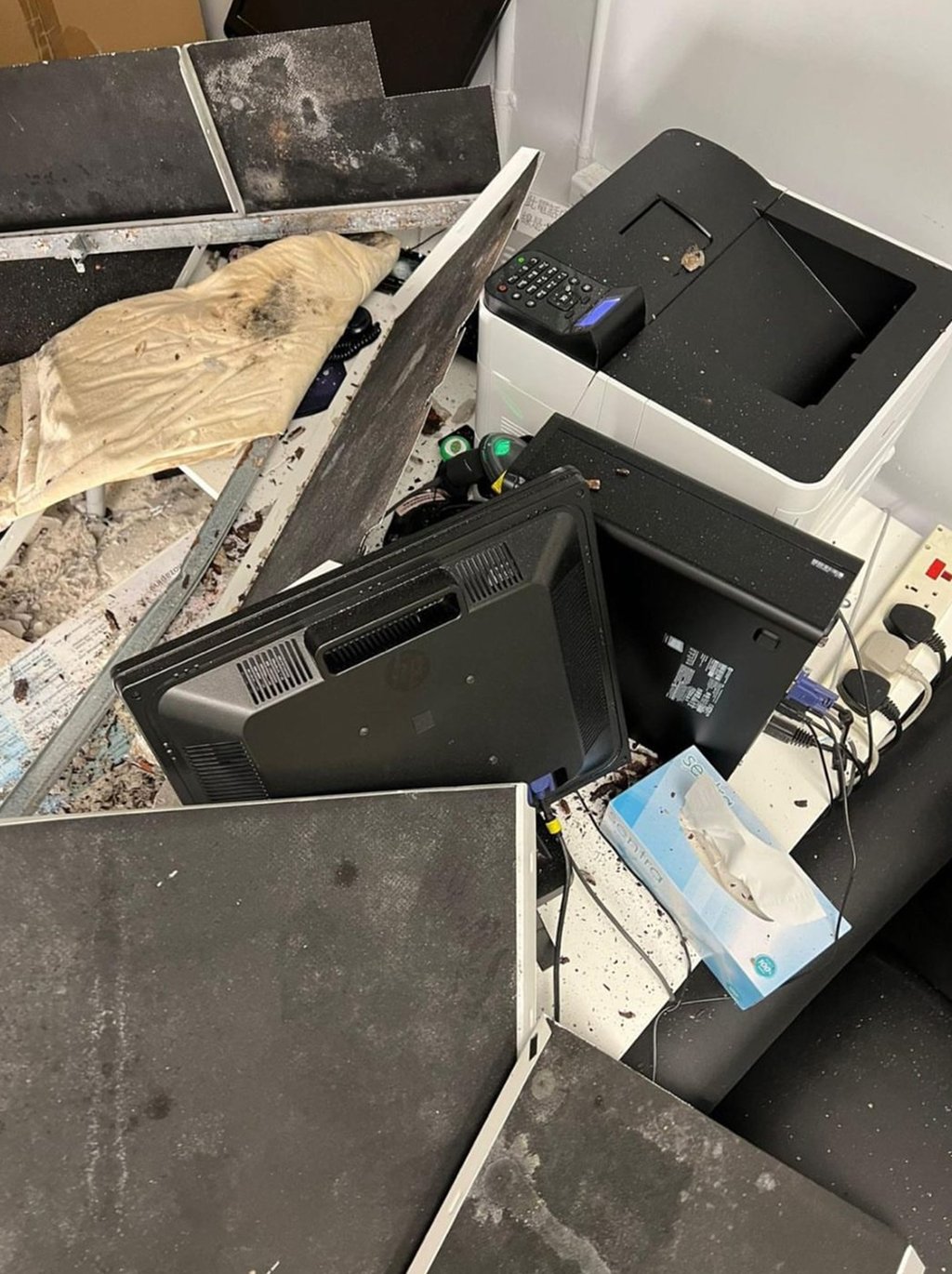 The mess caused by concrete falling from the ceiling of a consultation room in the paediatric and adolescent unit at Kwai Chung Hospital. Photo: Handout The mess caused by concrete falling from the ceiling of a consultation room in the paediatric and adolescent unit at Kwai Chung Hospital. Photo: Handout